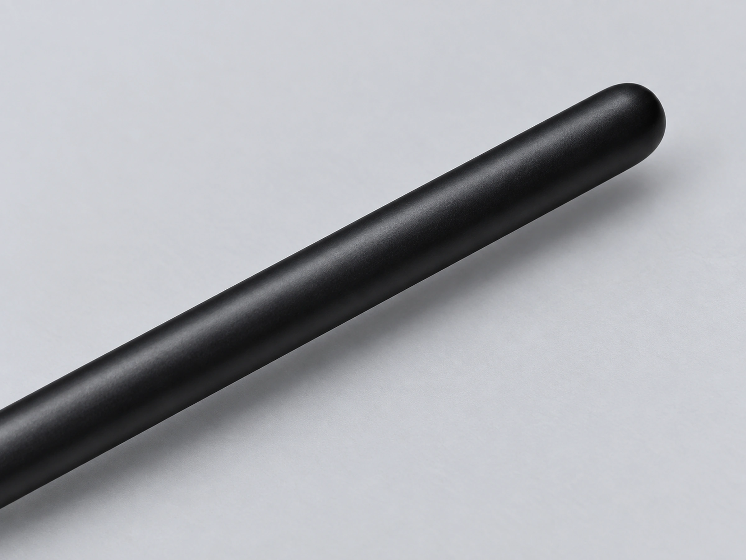 B5520 matte black solid-wood handle with a softly rounded tail