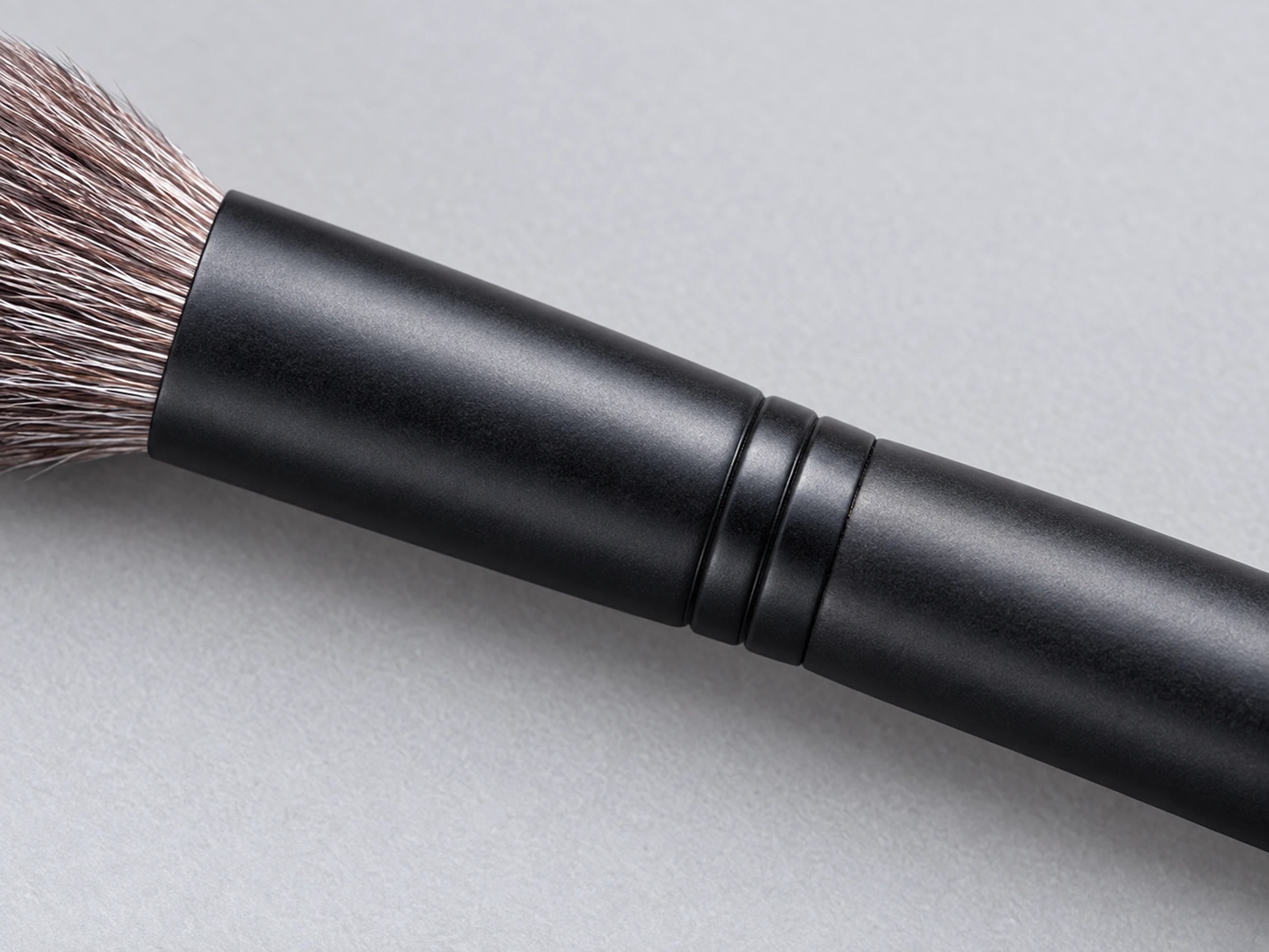 B5521 black copper ferrule and twin collar bands meeting its matte black solid-wood grip