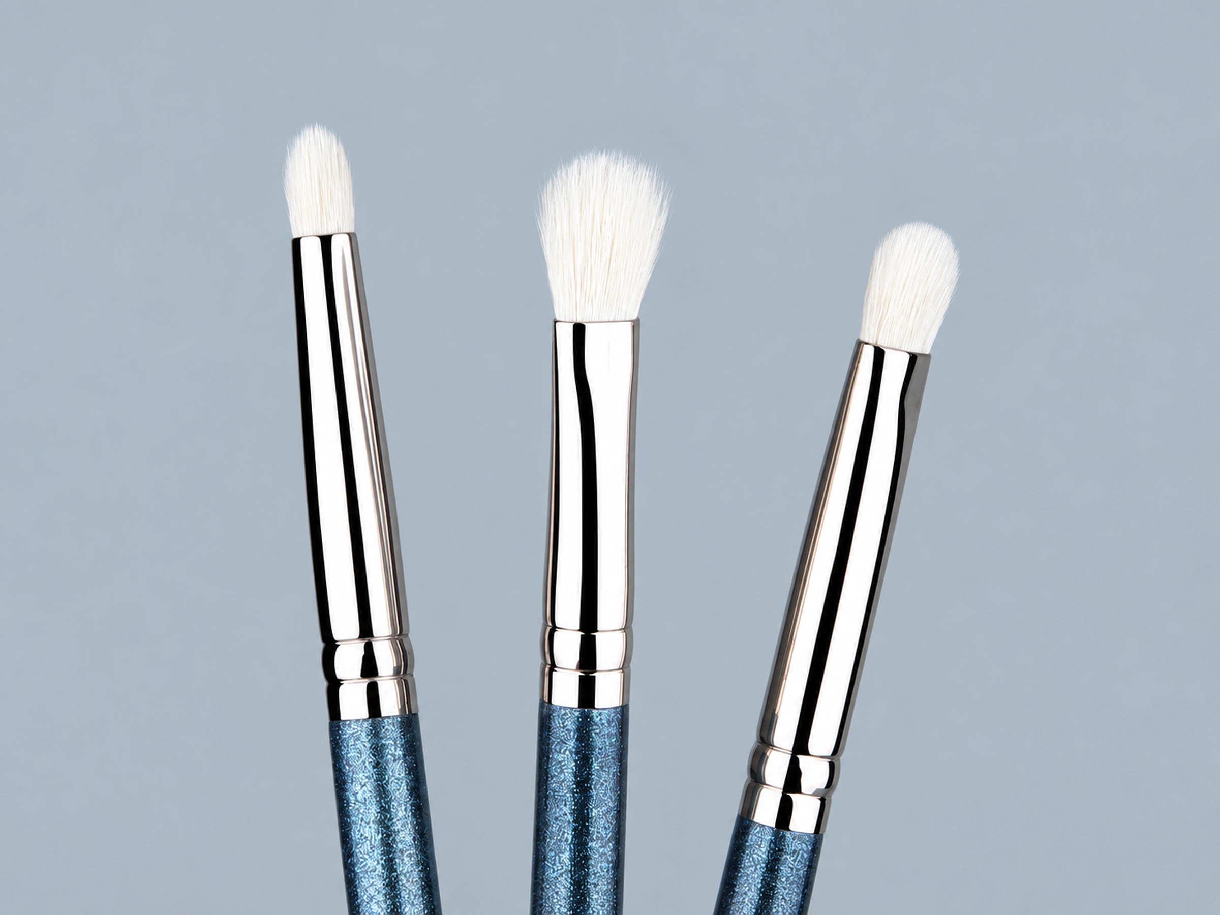 The three white eye brush shapes No.219, No.217 and No.239 with silver ferrules and pearlescent blue handles