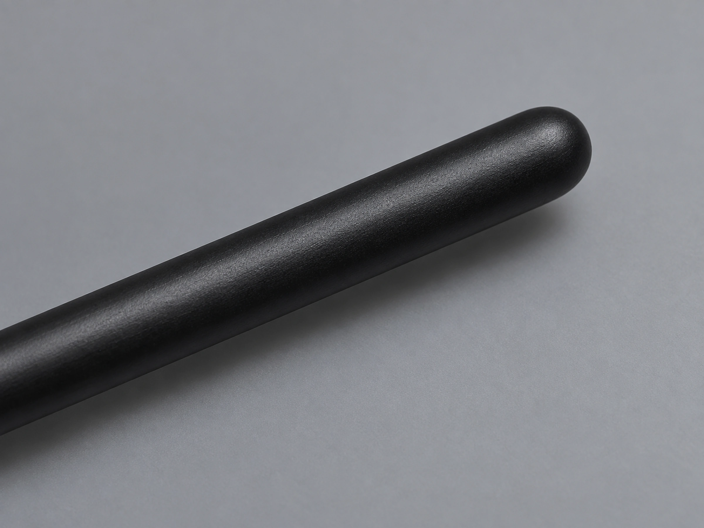 G5523 slim matte black solid-wood handle with a smoothly rounded tail