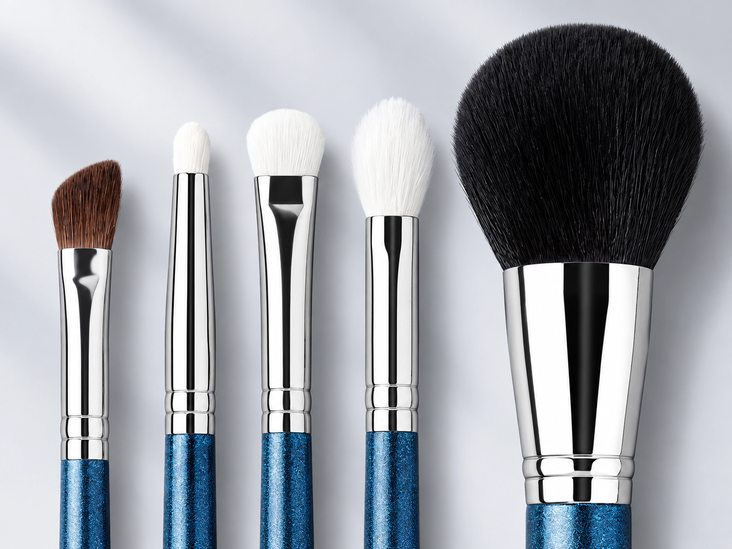 Five material examples from the nine-piece set: brown No.275, white No.219, No.239 and No.217, and large black No.134 with blue handles