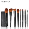 Nine AOLANLA makeup brushes with pouch on white background, original brand mark only