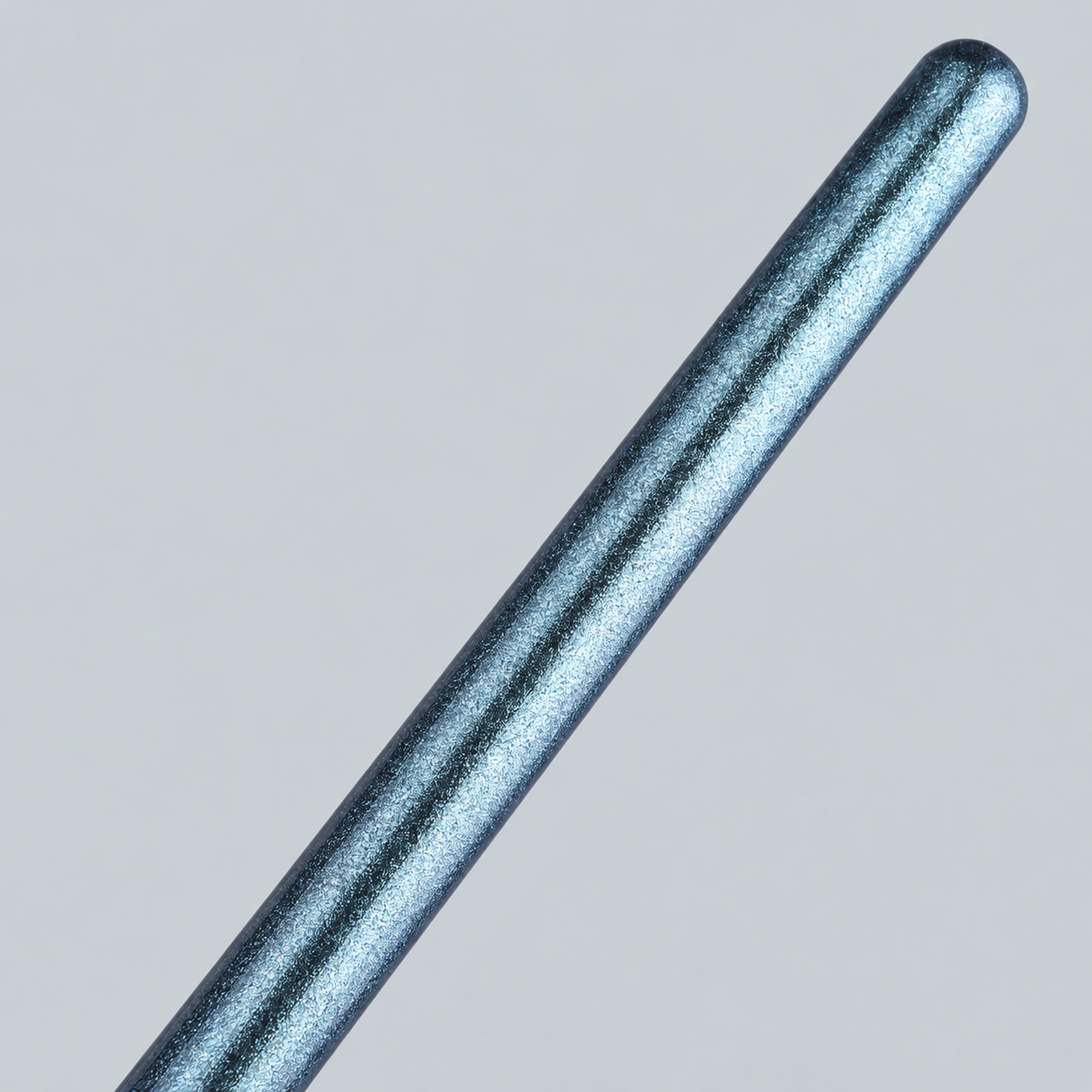 Macro of elongated blue pearlescent brushhandle