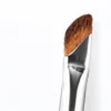 Source-matched brown small sickle brush head and reflective silver ferrule in close view