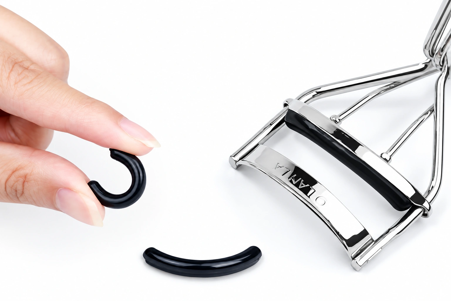 Supplier demonstration of a flexible rubber pad beside the silver eyelash curler jaw
