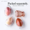 Three individual egg cases and rose-gold metal holder