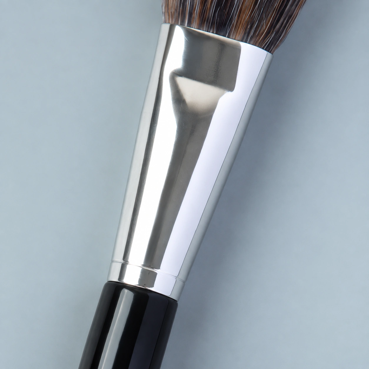 Close-up of the AOLANLA polished silver aluminium ferrule and its junction with a glossy black handle