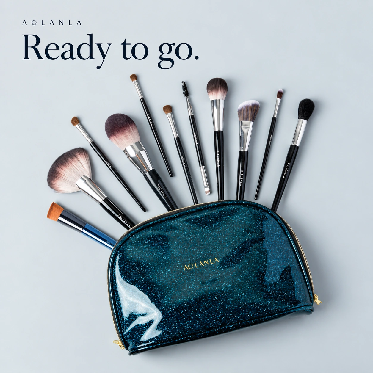 Blue-teal zippered makeup bag with the eleven AOLANLA brushes arranged around it