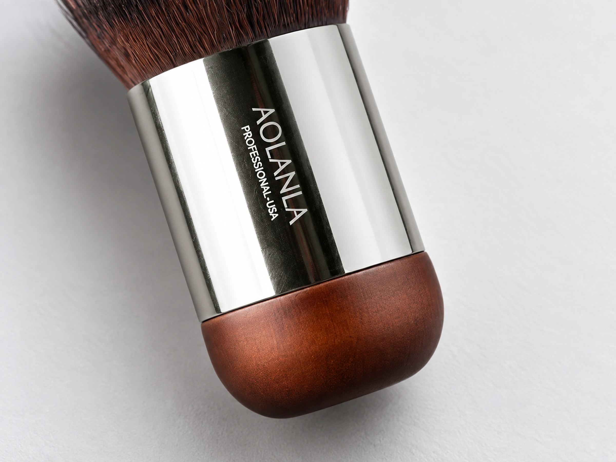 Original No112 short polished silver-tone metal cylinder meeting a thick rounded natural wooden base