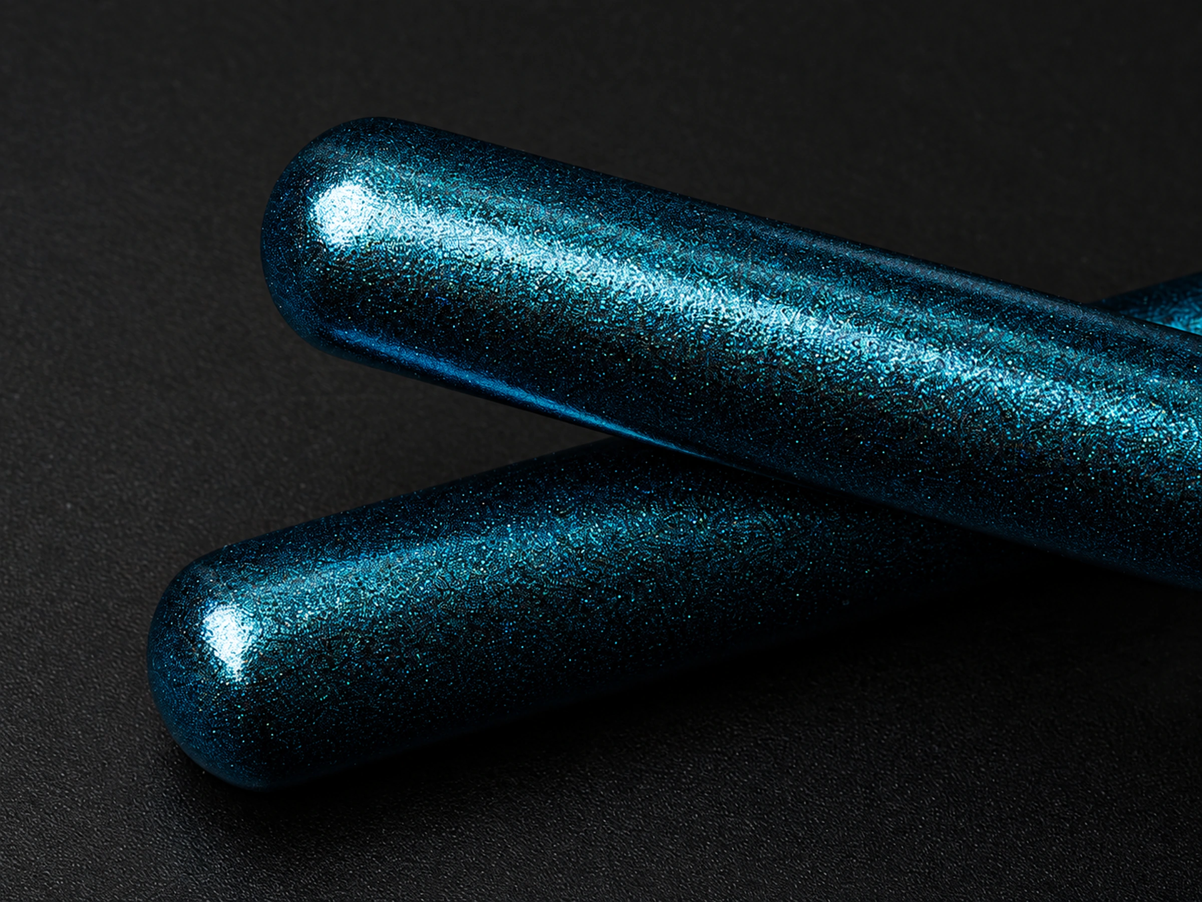 Close-up of the real rounded pearlescent blue grip ends showing their fine finish