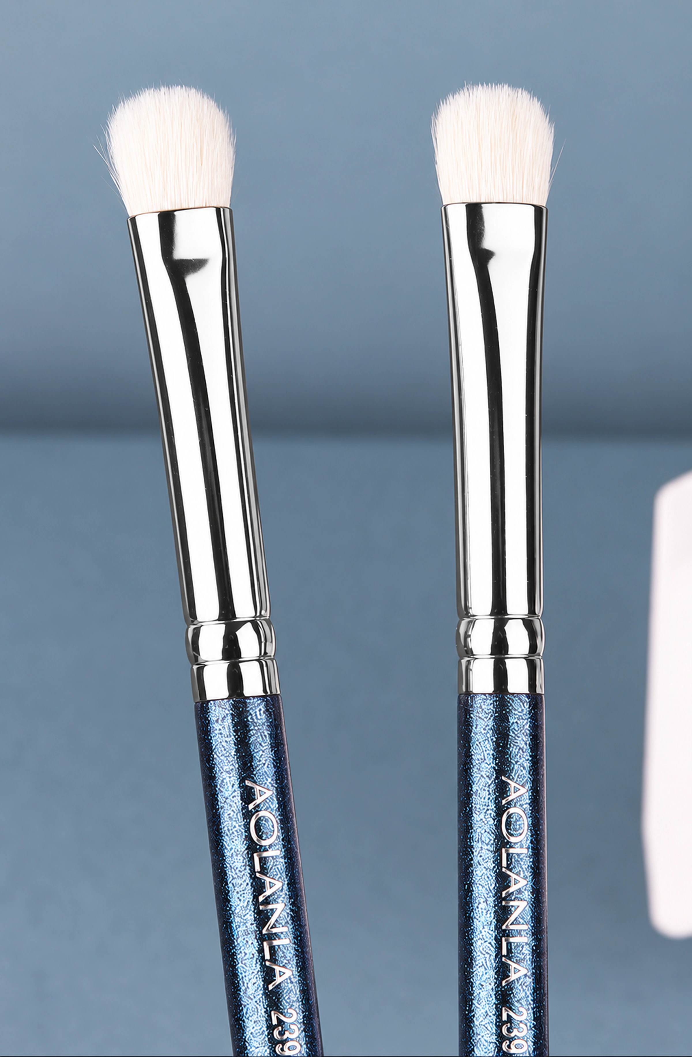 Two original No.239 orientations showing the wool-to-metal junction, double-ring connector and pearl-blue handle