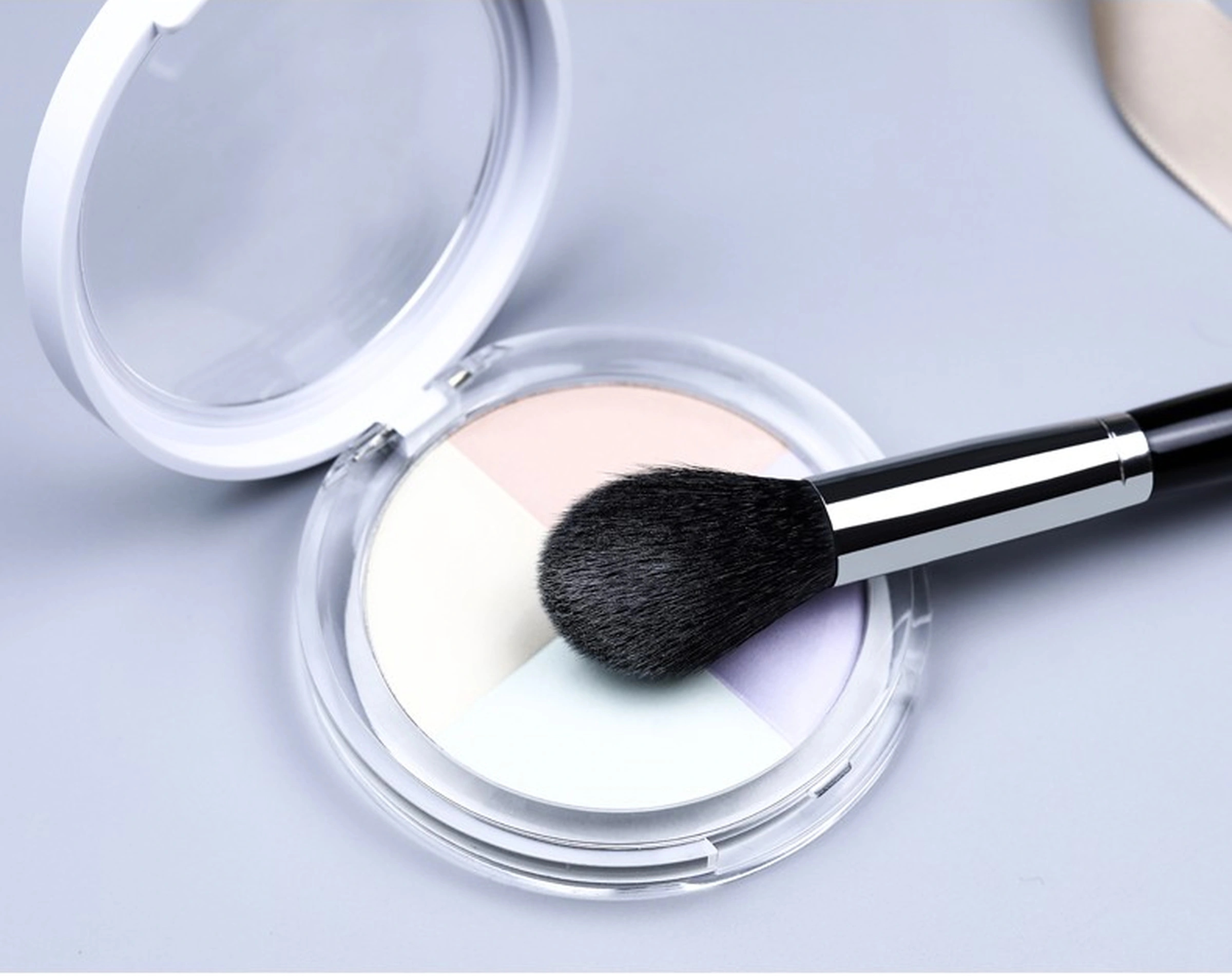 Original No.79 brush head placed at a pastel pressed-powder compact; compact not included