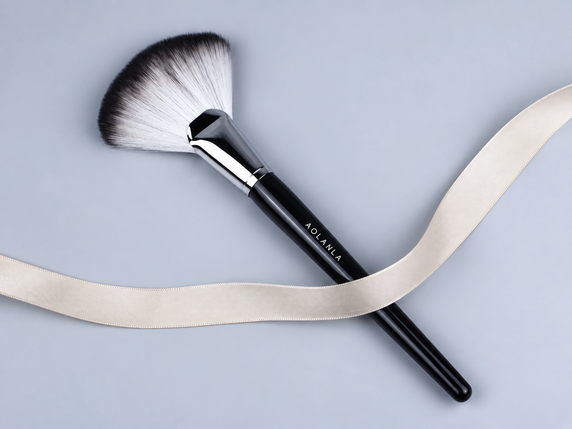 One complete original No92 fan brush on cool grey, ribbon is a styling prop