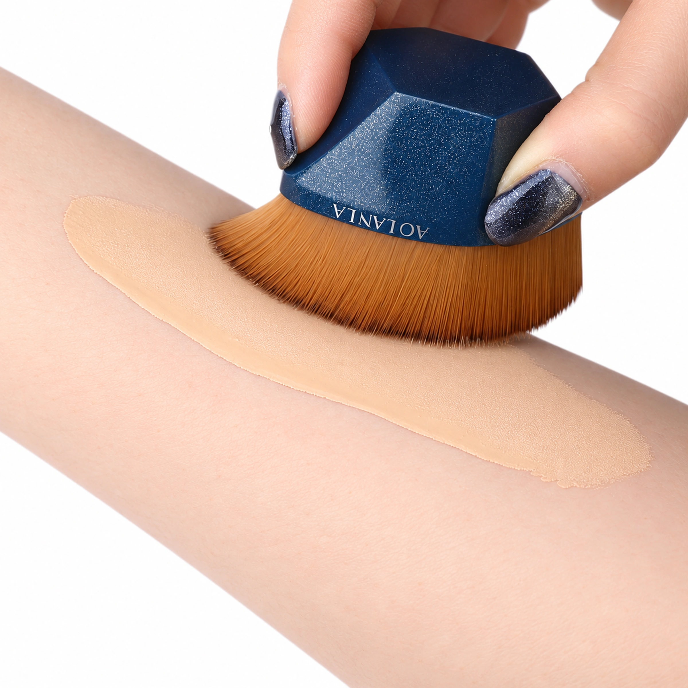 Blue55 foundation brush spreading liquid foundation on an arm
