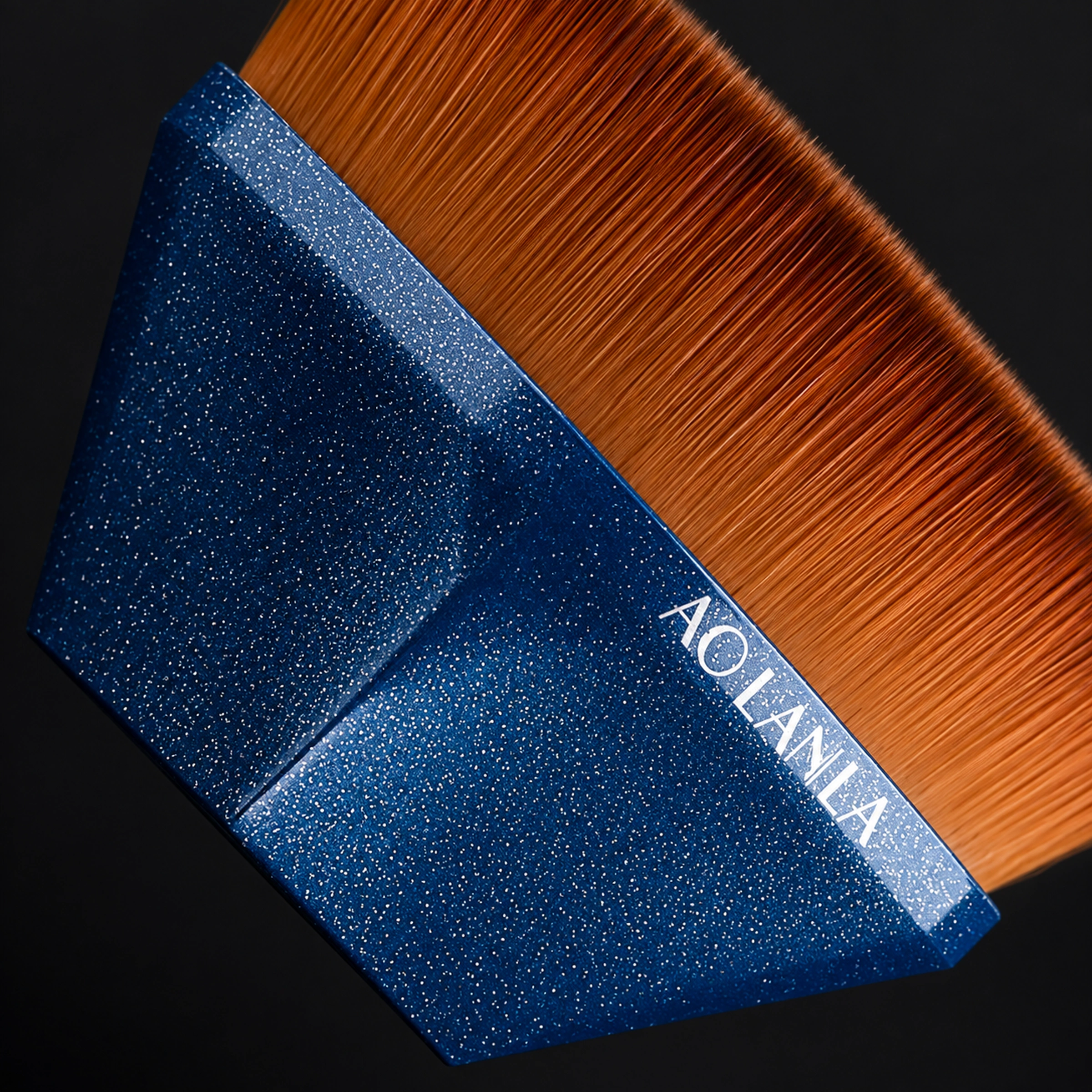 Macro of deep blue sparkle faceted grip and fibre junction