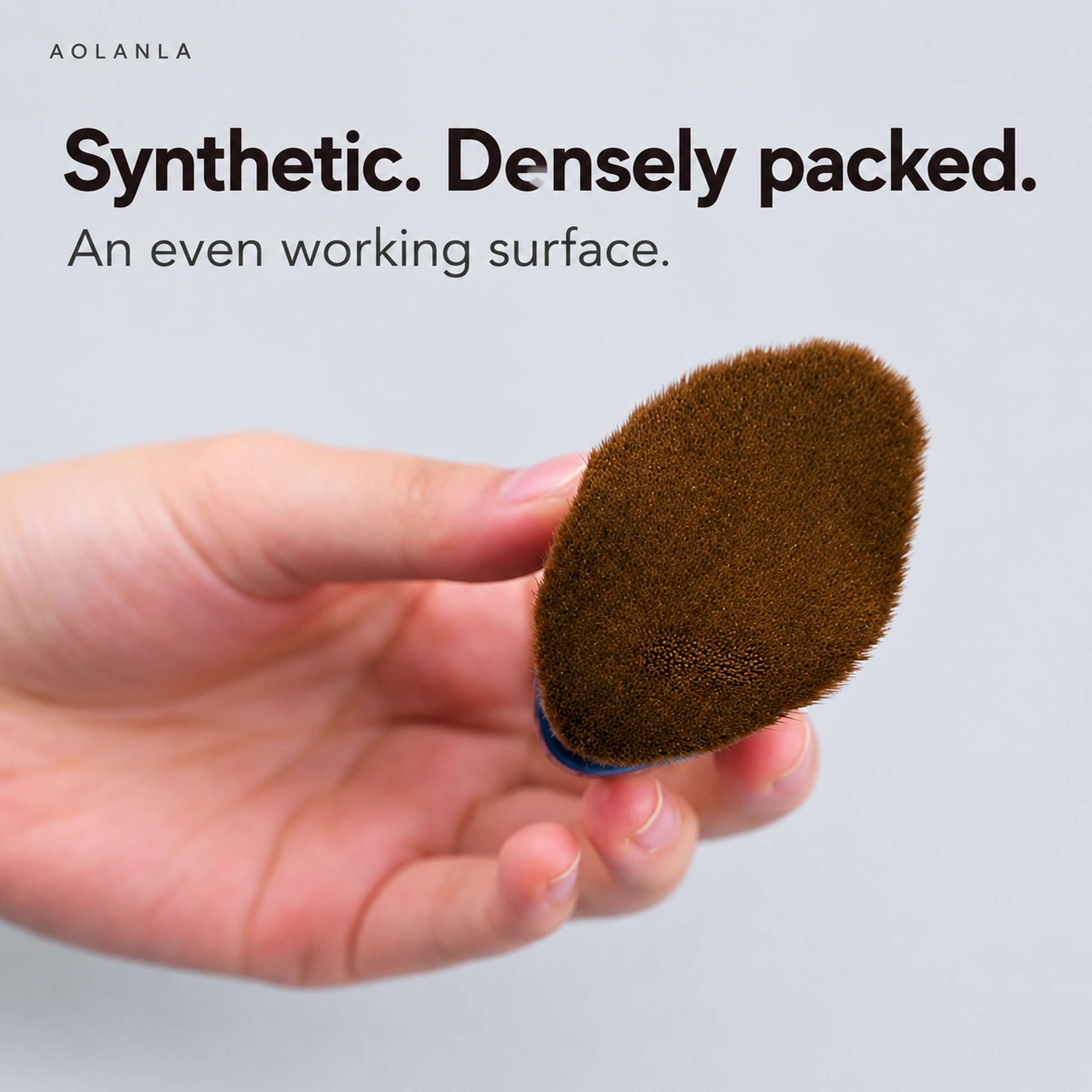 Synthetic fibre working surface of the foundation brush held in one hand