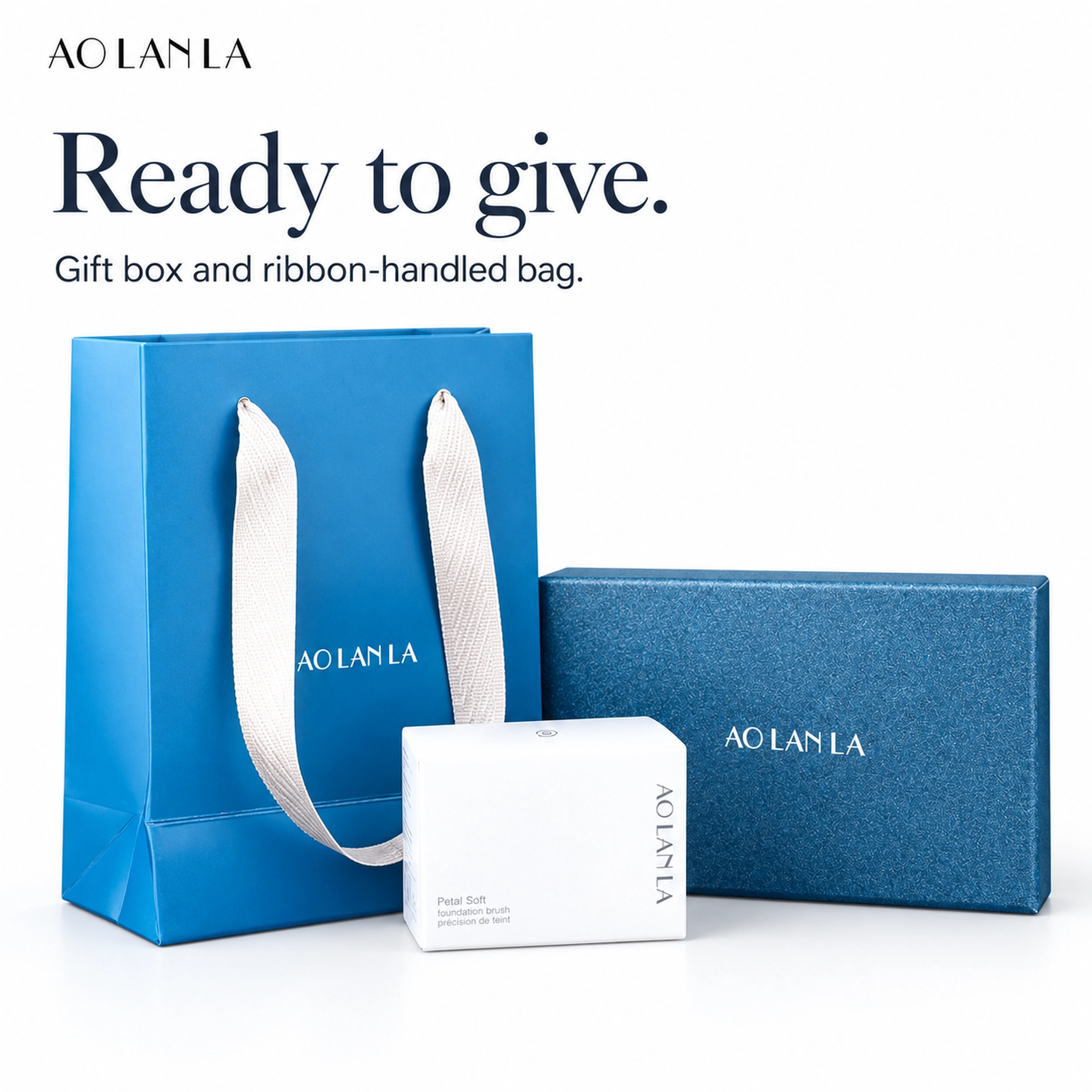 Blue gift box, white inner carton and blue paper gift bag with ribbon handles