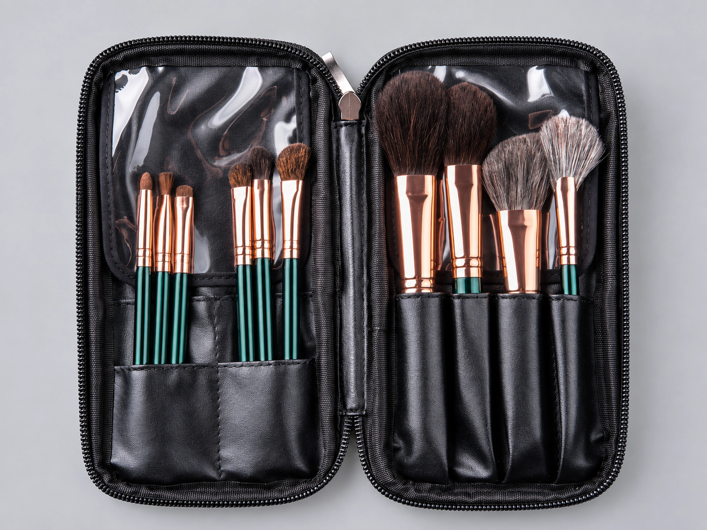 Original opened black zip pouch: six small eye and lip brushes on the left and four face brushes on the right