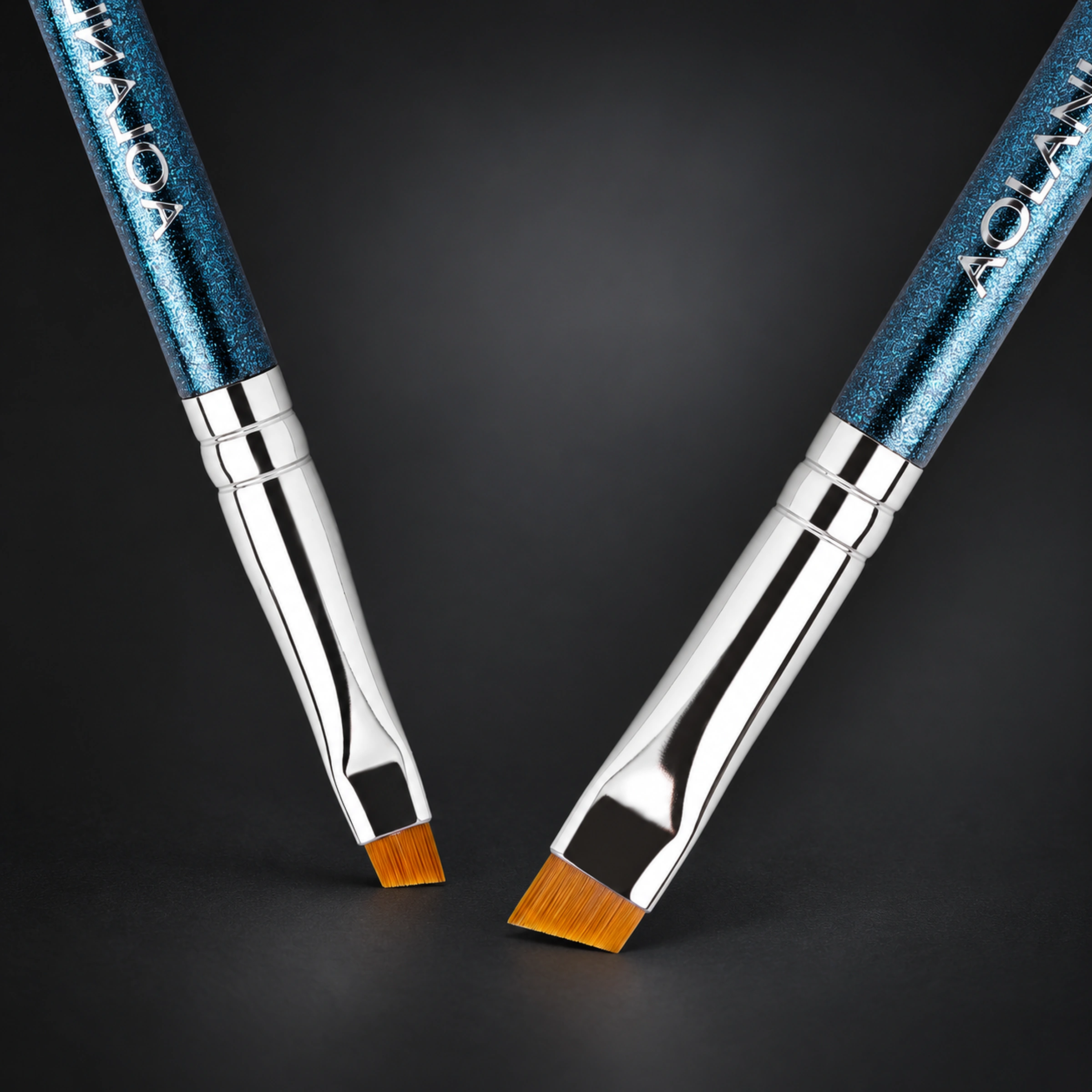 The short golden eyeliner and angled eyebrow heads with their real silver ferrules