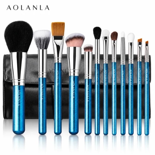 Twelve actual brushes with blue pearlescent handles and black folding pouch on pure white