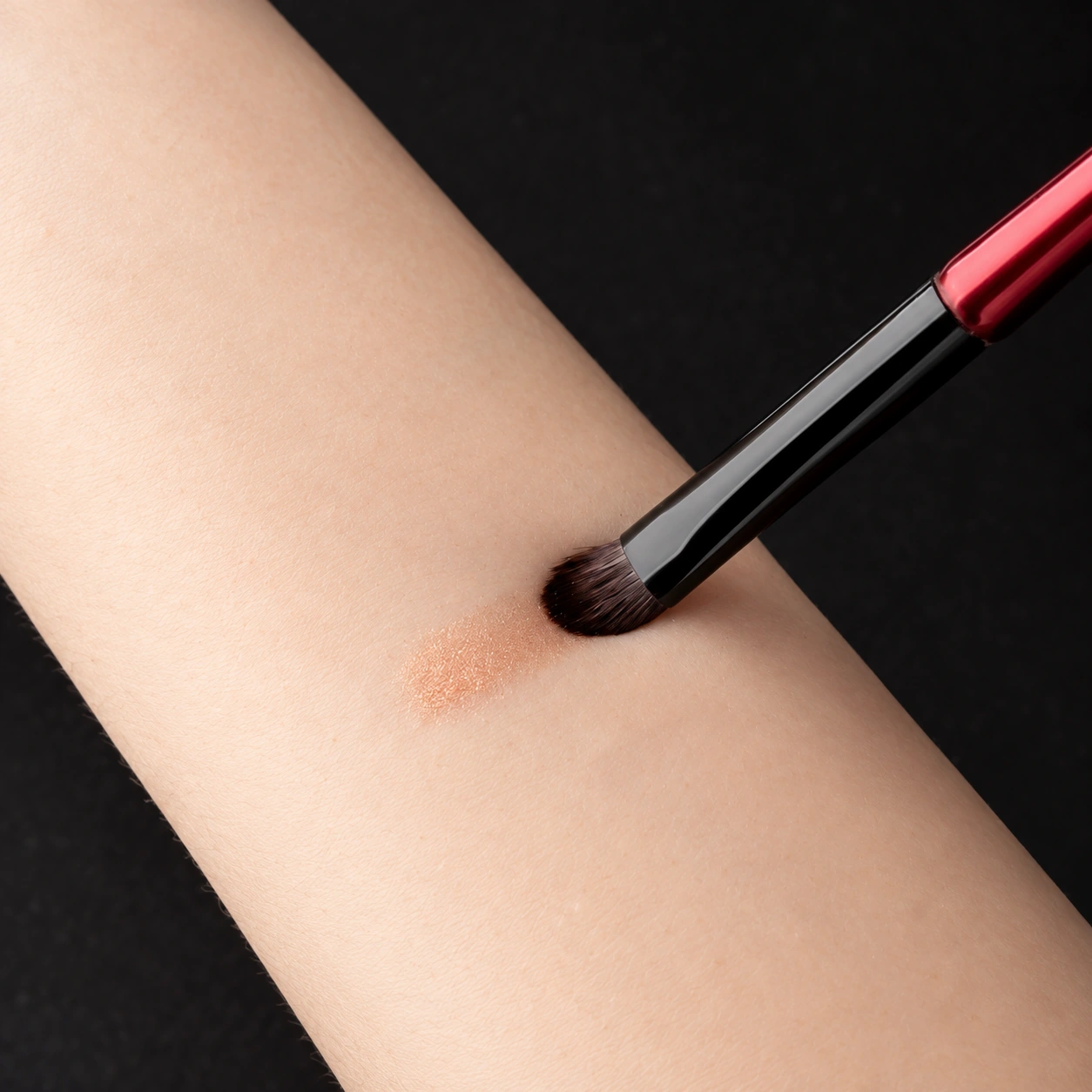 Phoenix brush making gentle contact with one forearm