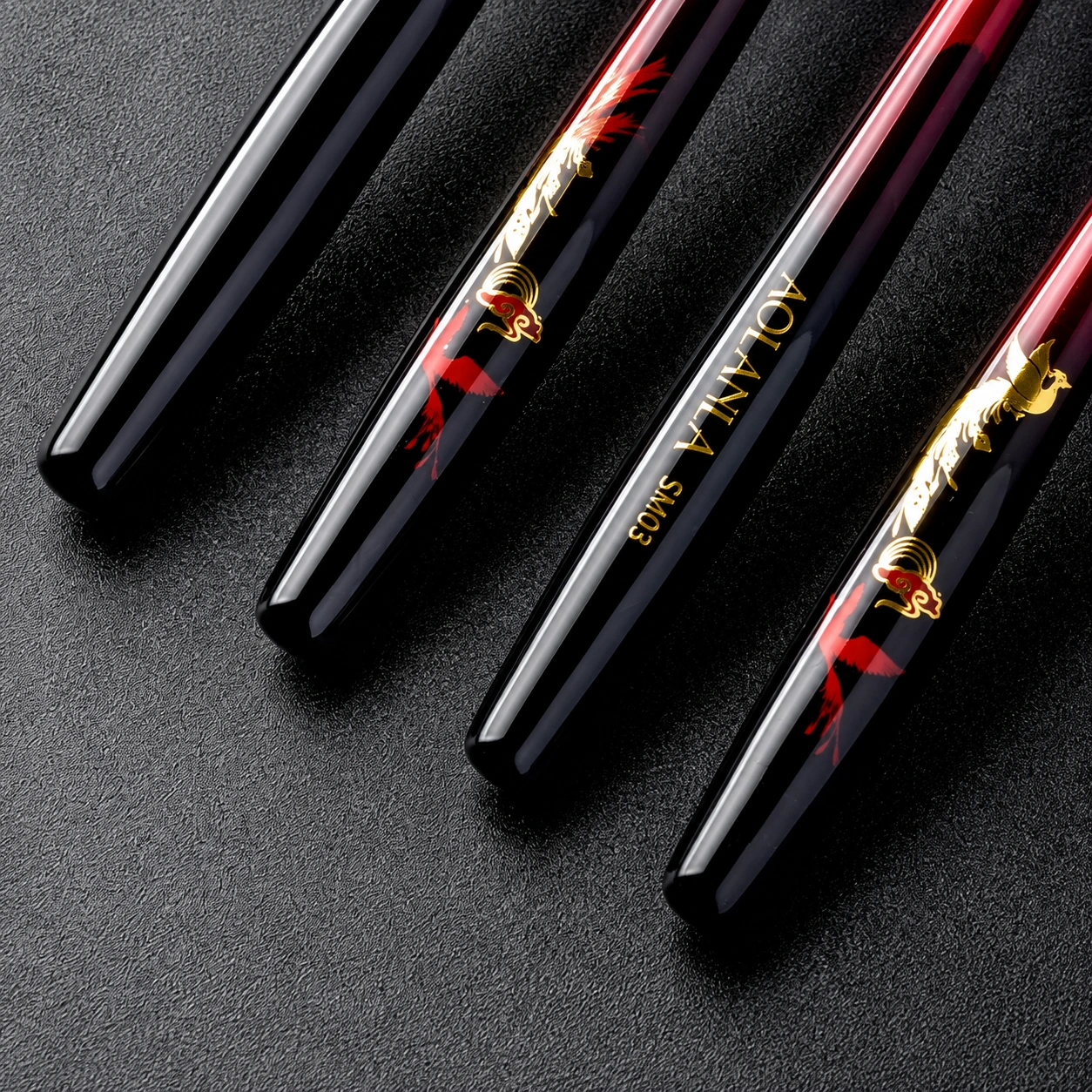 Four Phoenix handle ends with golden phoenix artwork and model lettering