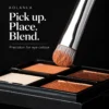 Travel eyeshadow brush picking up powder colour