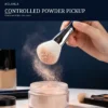 Blue Sakura face brush picking up loose powder