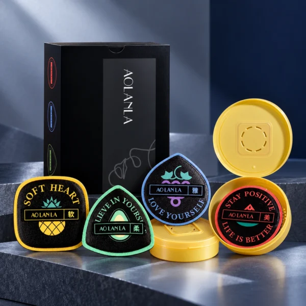 Four AOLANLA Aurora XL fruit-series powder puffs with two ventilated storage cases