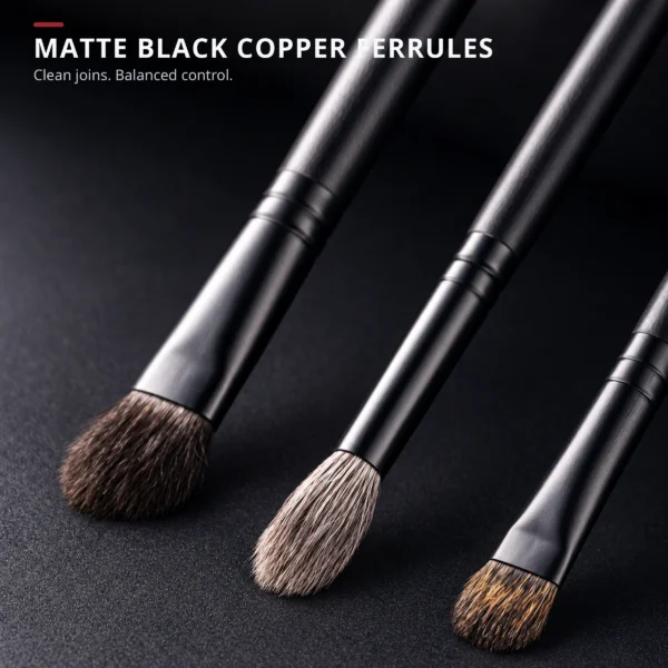 Matte-black copper ferrules and dark wood handles with clean joins and balanced control