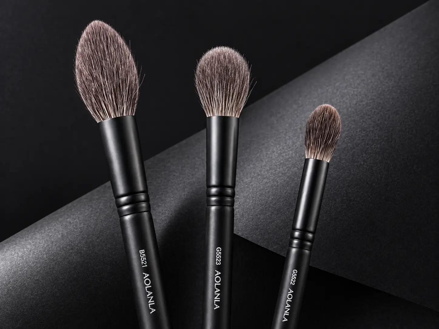 Three distinct AOLANLA grey squirrel brush tapers for highlight blending and detail work