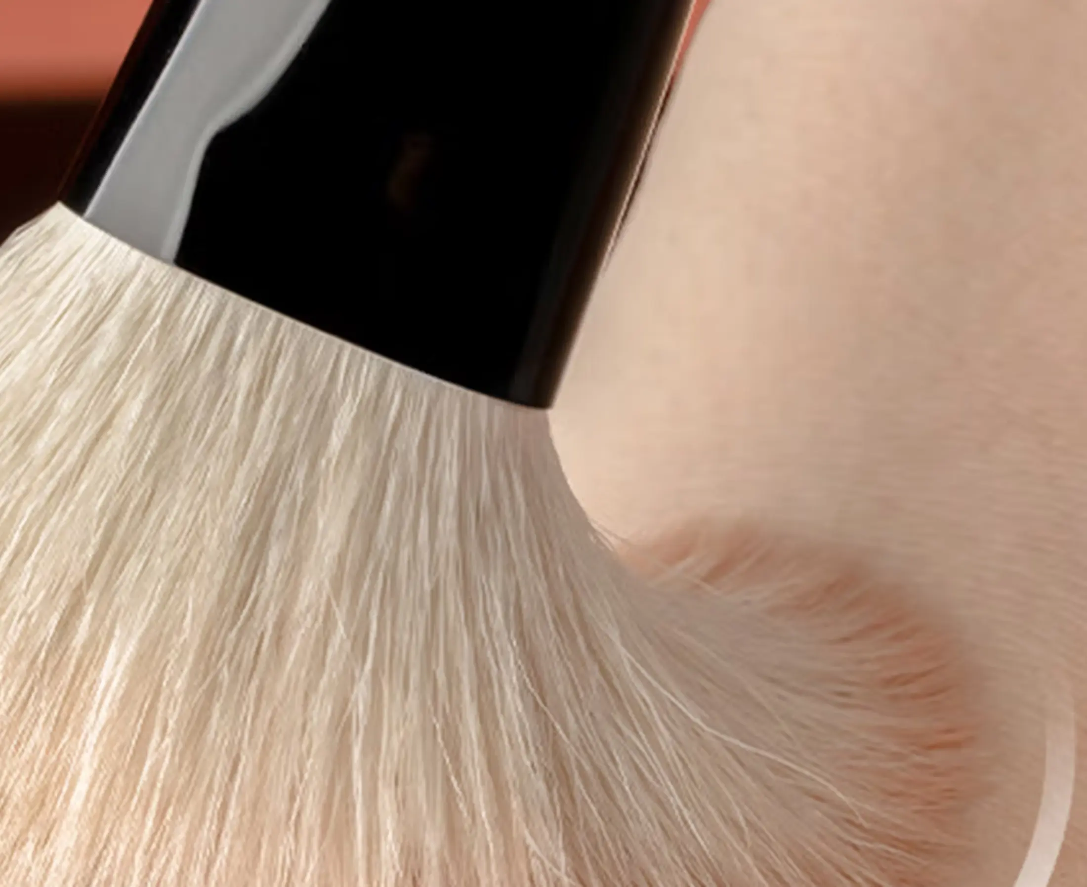 Soft pale brush fibres flexing gently against skin