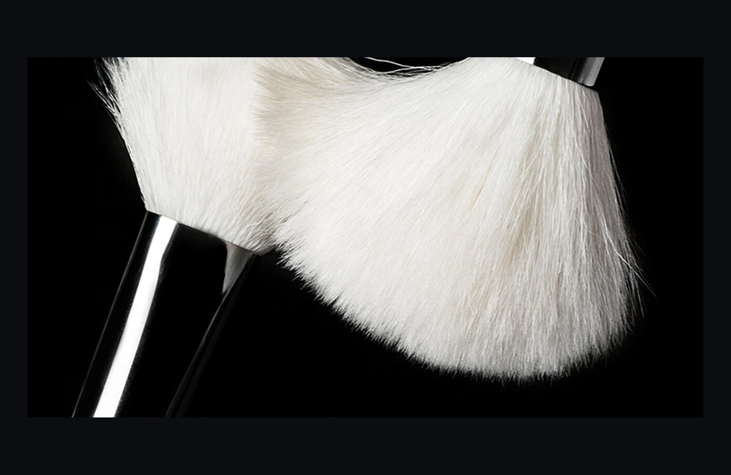 White Feather natural wool fibres flexing softly against another brush